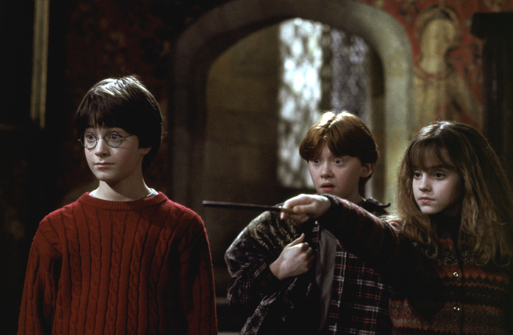 Still image from Harry Potter and the Sorcere's Stone featuring Harry, Ron, and Hermoine.